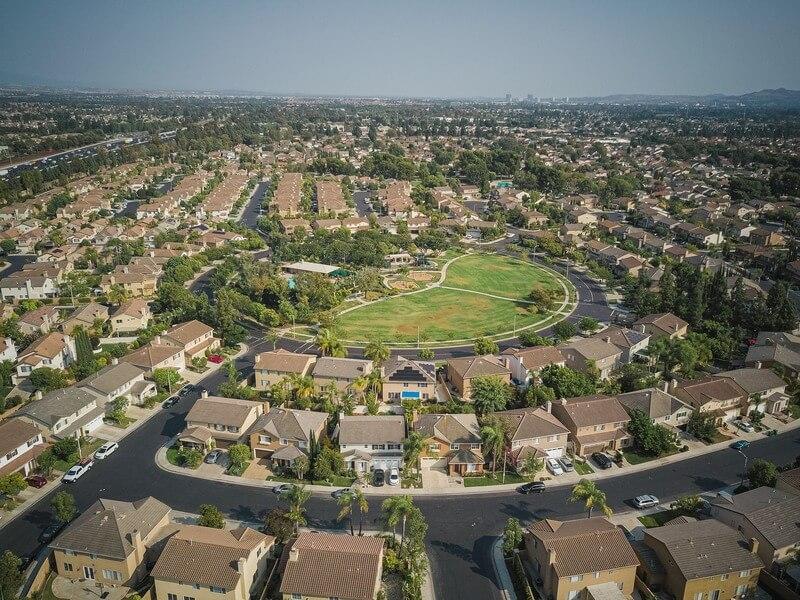 5. REAL ESTATE VS THE STOCK MARKET (2010–2025) - A Typical American Neighborhood